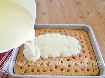 Pour pudding over cake. Taking care to get it into the holes as much as possible.
