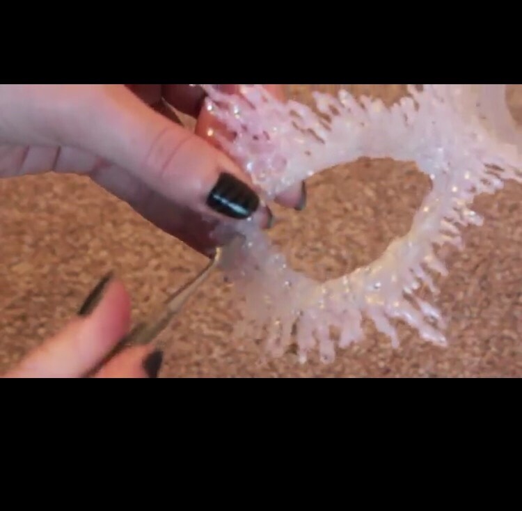 Make a small hole and add the string.