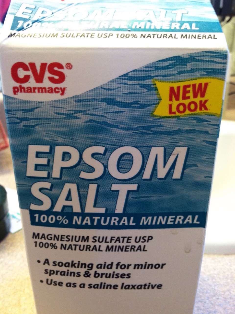 Pour about a quarter to half a bag/box of epsons salt into tub .