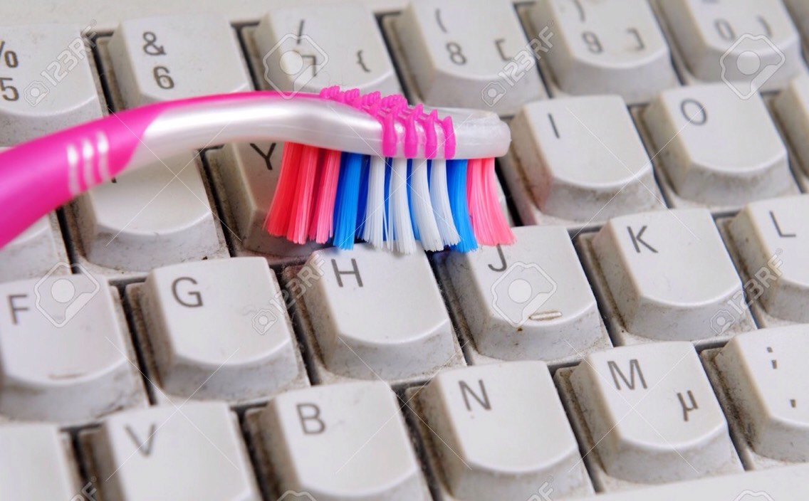 ...or using an old toothbrush to clean hard to reach places, like in between the keys of a keyboard