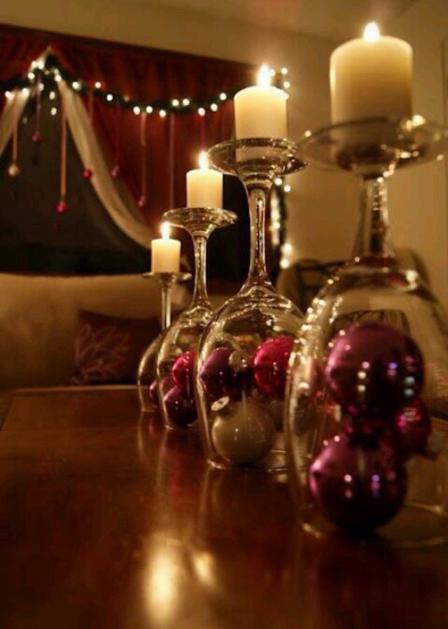Get wine glasses and fill with baubles. Turn upside down and place candles on top.