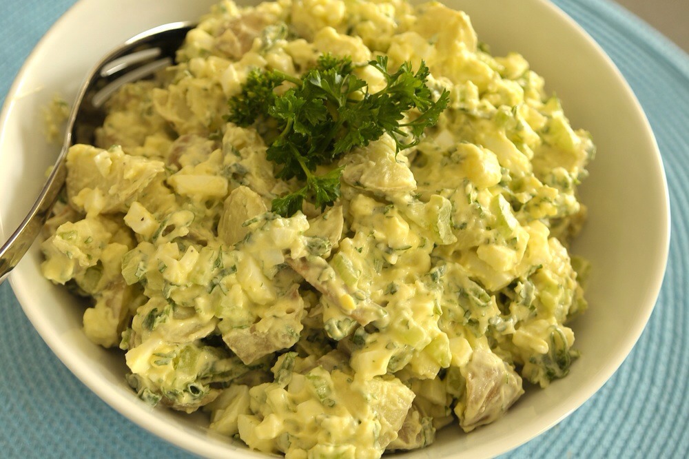 47. American Potato Salad: Whisk mayo with parsley, relish and mustard. Toss with boiled quartered potatoes, and sliced celery and red onion. Fold in chopped hard-boiled eggs; season with salt and pepper.