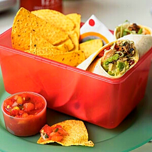 Chipotle Pork and Avocado Wraps
Pair with some baked tortilla chips.
Portion servings into zip-top plastic bags so you won’t go overboard with sides and snacks. Most baked tortillas chips are around 120 calories per 1-ounce serving. Pair with an apple or mango slices for a complete meal.