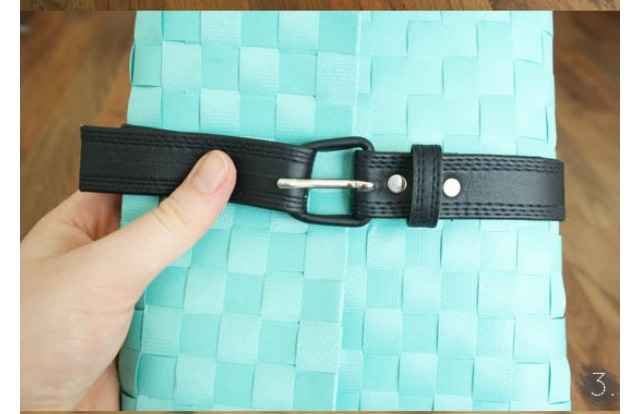 Next fold belt around your clutch and decide where to cut the belt to fit snug around the clutch. After this use your whole punch to punch 2 wholes in belt to close clutch. The first whole for an almost empty clutch and the next whole for when the clutch is almost full with room to grow . 