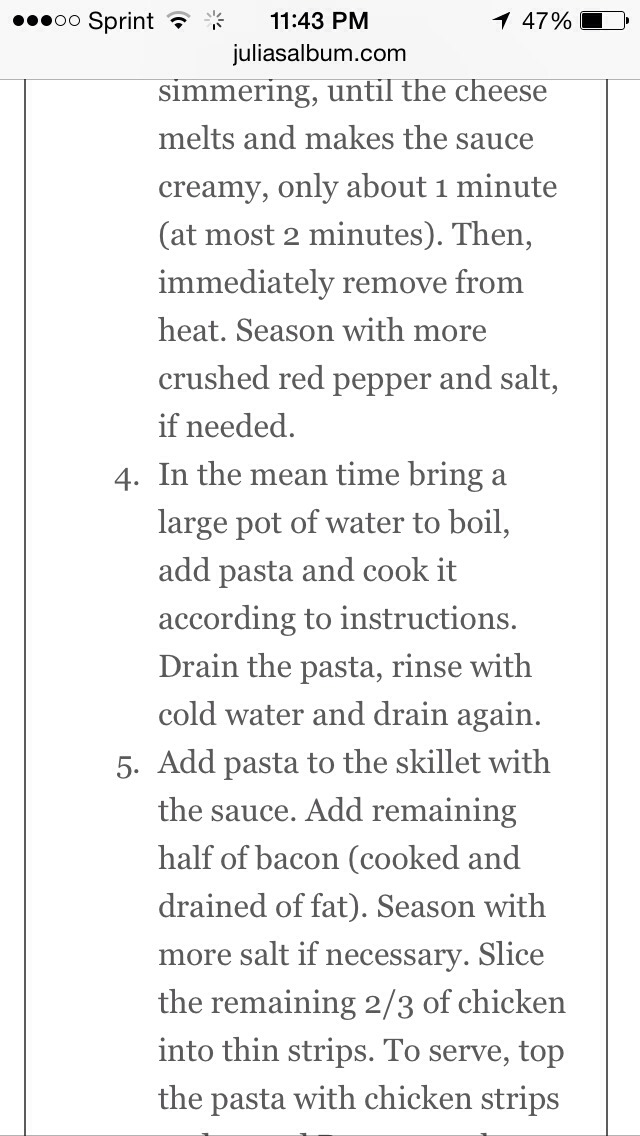 Chicken and bacon pasta with spinach and tomatoes in garlic cream sauce
