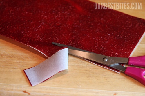 I like to use a pizza cutter and trim all of the edges (my kids love to eat that part) so I have nice clean lines to work with.  Because I’m a freak like that. If you have a good (clean) pair of scissors, you could roll the whole sheet and then just snip all the way through the roll. 