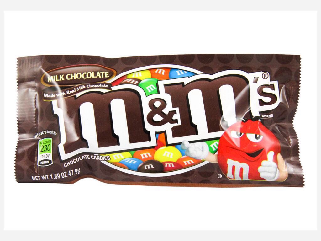 4. Take one brown M&M and put it in the corner of the white stuffing on the Oreo. You will need 2 for each cupcake.