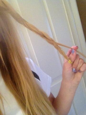 Secure with a hair tie and take another loose strand of hair. Wrap the strand around the braid, giving off a unique and detailed look! 😄👌💞