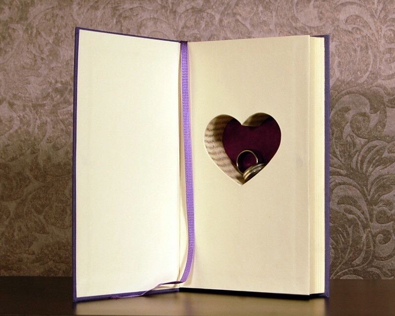 Have your ring bearer carry out a copy of you and your S.O.'s favorite book. It's sure to get a good response!