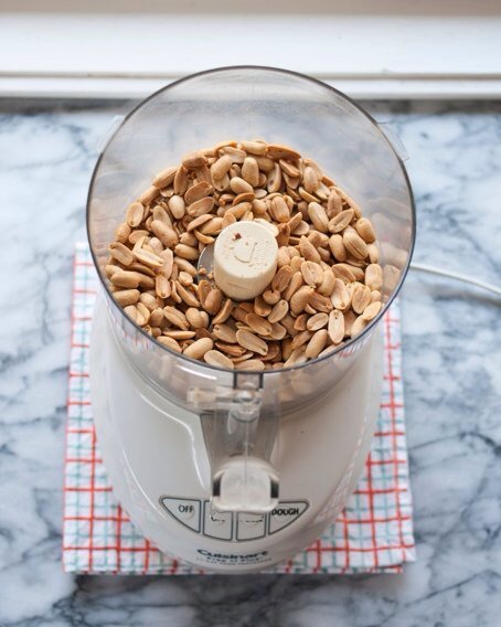 Move the peanuts to a blender or food processor, Make sure you put them in while they are still warm.