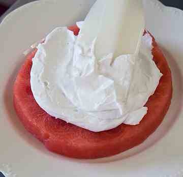 Add a generous layer of coconut frosting.