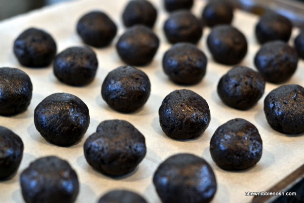 FOURTH STEP: 
Start rolling your crushed Oreos into little balls. (As seen in the picture.) Lay it out nicely on a tray as you go.