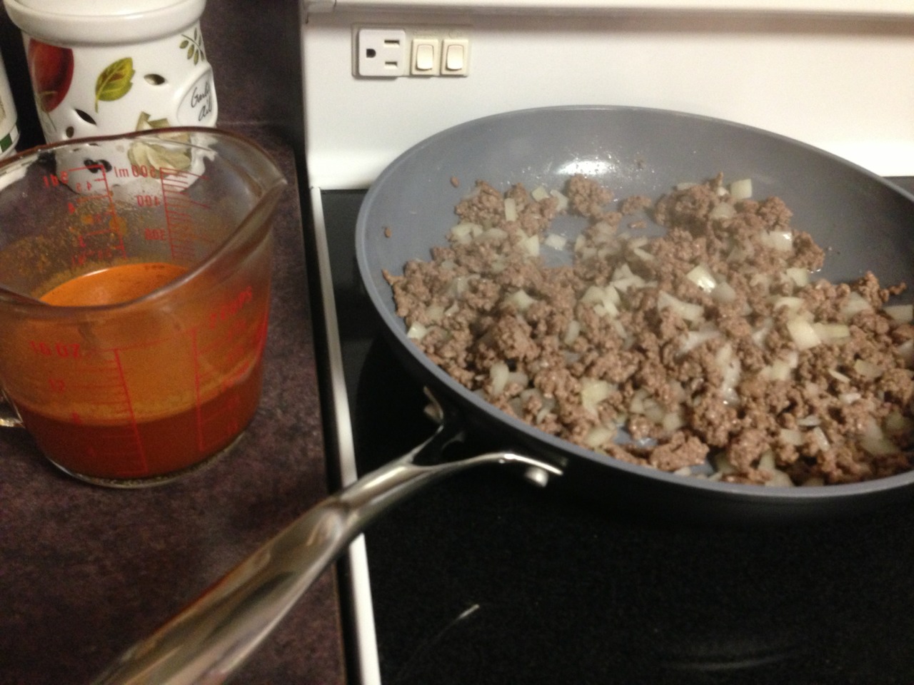 Put onions and hamburger meat in frying pan with some oil on medium heat
