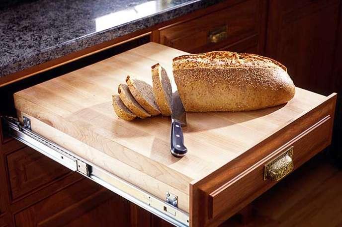 More space in small kitchen:
Add a cutting board to a drawer to free up counter space.