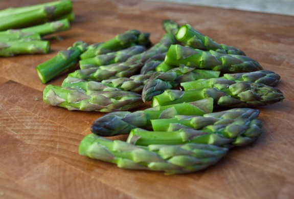 While that’s going, prep the asparagus. Trim off the tips (you’ll use them for a garnish), then cut the remaining spears into 1/2-inch pieces.