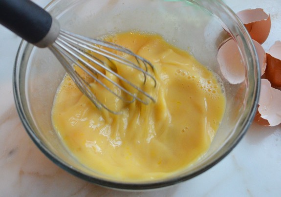 Combine 1 beaten egg, milk, cooking oil, and canned pumpkin in a separate bowl from the dry ingredients and mix well