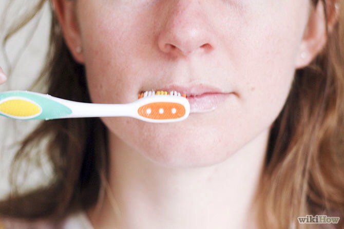 With your lip scrub still on, gently rub your lips with an old toothbrush. The bristles, along with your lip scrub, will exfoliate your lips and get your blood vessels pumping, so your lips will look redder when you're done. Wipe off with a moist face cloth.