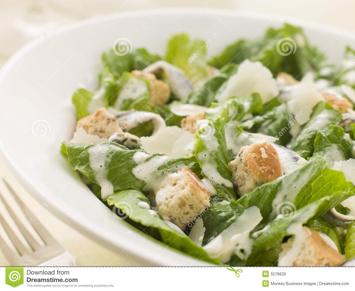 9. Caesar Salad: Purée minced garlic and anchovies, lemon juice, Worcestershire sauce, salt, pepper and 1 egg yolk; with machine running, slowly add 1/4 cup olive oil. Toss with romaine; top with Parmesan and croutons.