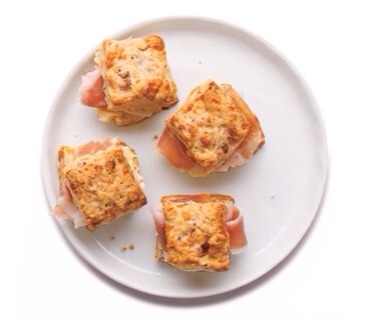 Cheddar and Pecan Mini Scones
Bake the savory scones until golden, then split, spread with butter, and add prosciutto for a delicious mini-sandwich.