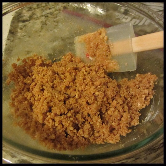 Step 1:
Preheat oven to 350°F (180°C). Place graham crackers into a large resealable plastic bag. Finely crush into crumbs. Combine graham cracker crumbs, powdered sugar and butter in Small Batter Bowl.