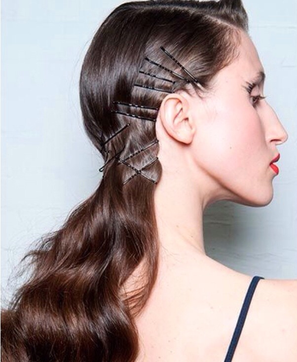 Don't let the style's creativity intimidate you: Tame wavy hair by clipping anywhere so hair doesn't budge.

