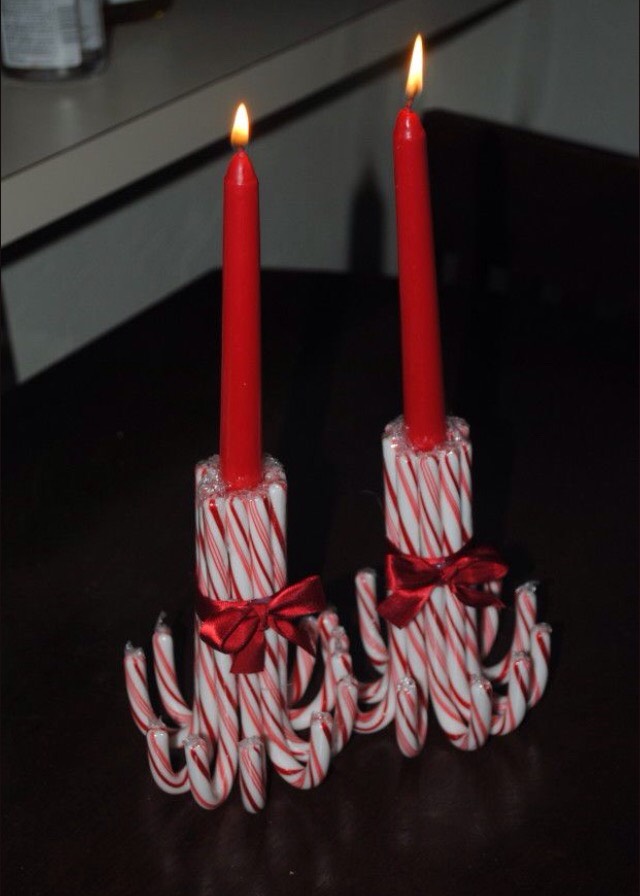 Glue candy canes together around candle to make these cute Christmas themed decorations.