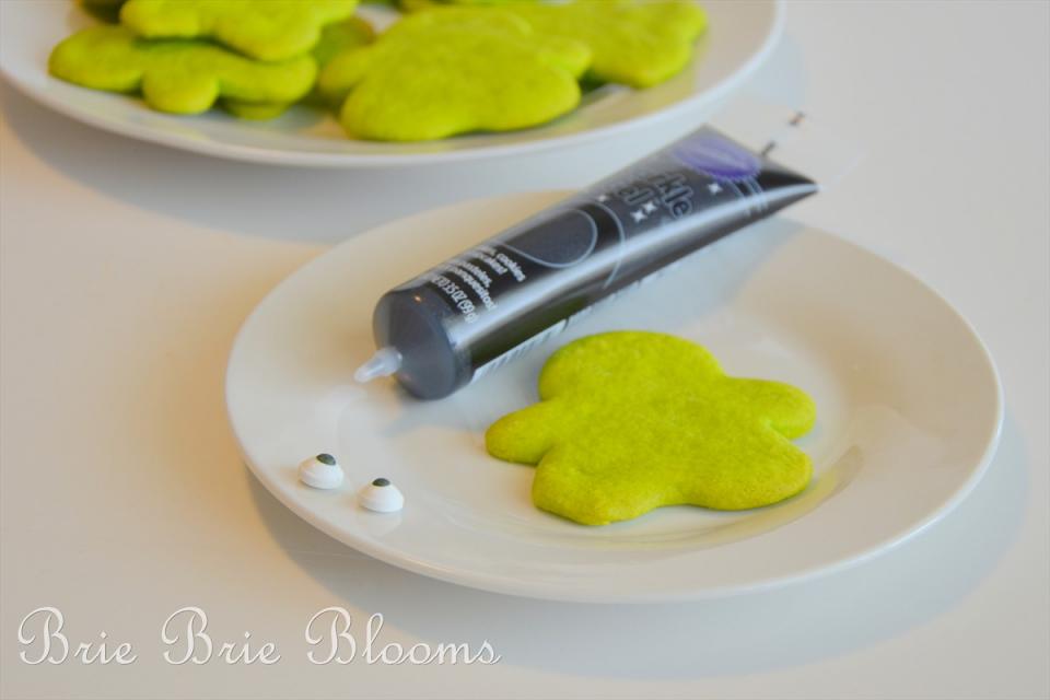 Use the sparkle gel and candy eyeballs to turn your green gingerbread men into Frankenstein cookies.