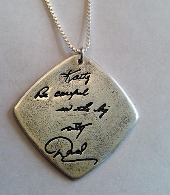 A pendant with an engraved message in a loved one’s handwriting.