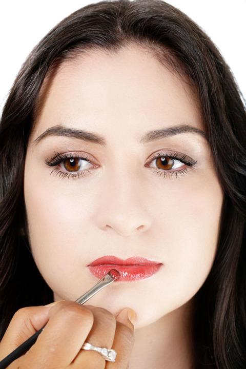 10. Swipe on Lip Gloss:- Apply a slick of sheer off-red gloss straight from the tube onto your lips, or use a lip brush.