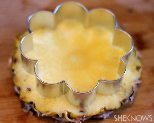 Simply use cookie cutters an a small knife to shape fruit into small flower shapes 
