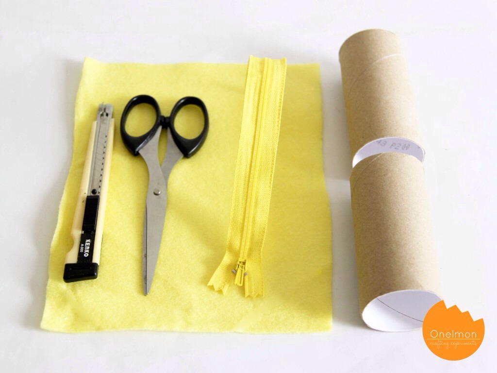 Here's what you'll need: felt, scissors, a zipper, tape, needle and thread and toilet roll (just the cardboard!)
