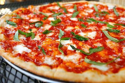 1. Margherita Stretch dough into two thin 9-inch rounds. Top each with 1/2 cup crushed San Marzano tomatoes, dried oregano, salt, pepper and olive oil; bake until golden. Sprinkle with1/2 pound diced mozzarella, torn basil and salt. Bake until the cheese melts, then drizzle with olive oil.



Read m