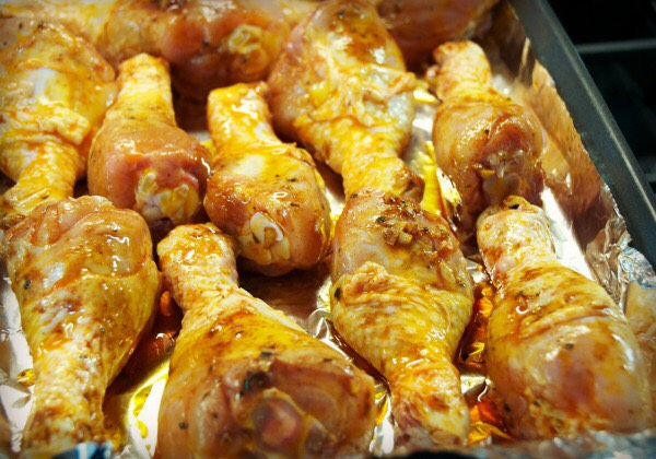 Set on baking sheets and before putting the chicken in the oven drizzle the sauce over the chicken. Then half way through baking add the rest of the sauce over the legs evenly.