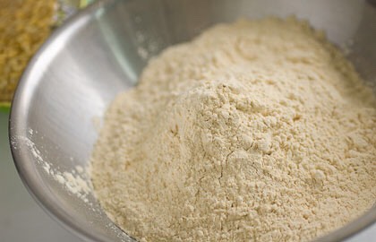 Add 2 tablespoons of gram flour. This will also help to take the stain off the turmeric powder after you wash it off.