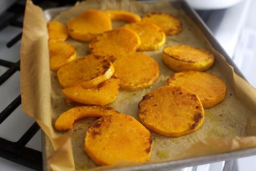 Transfer mixture to prepared sheet and roast until tender and slightly colored, anywhere from 15 to 30 minutes (depending on the density of the squash you use), flipping once about 2/3 of the way through. 