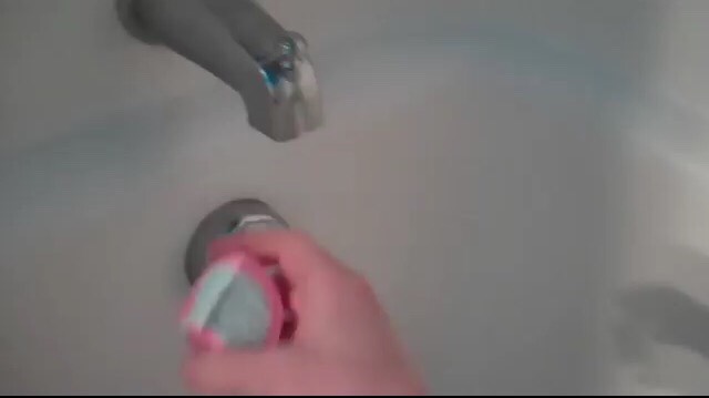 Run the piece under the water. 
If want more bubbles irritate the water and splash it around after desolved