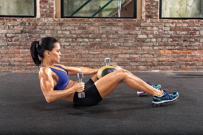 C-Static Hold-Row

• Sit on the floor with knees bent, ball between thighs. Hold a light dumbbell in each hand, palms facing in. Sit back, bringing elbows to floor below shoulders.

• Release elbows and extend arms to chest height, then row right elbow back, keeping left arm extended. Switch sides, 