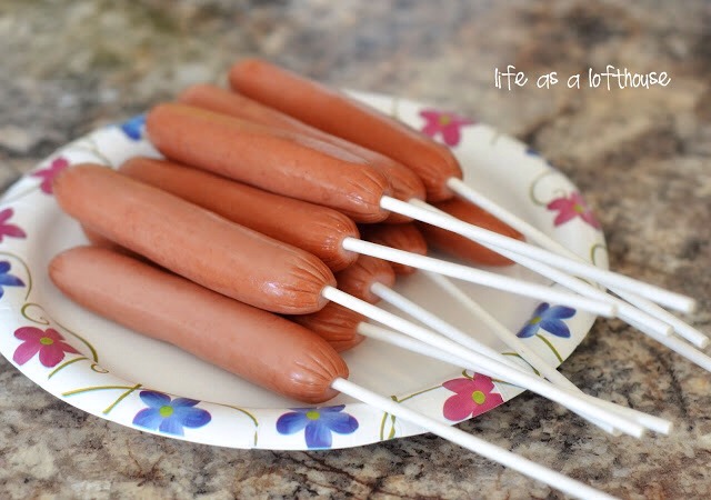 Remove hot dogs from package. Wipe them all dry with a paper towel (this will help the batter stick to them better) Insert one skewer or wooden stick into each hot dog.

