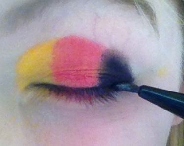 Apply a thin line of eyeliner to define your eyes.