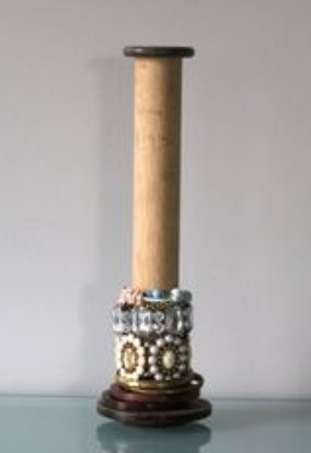 A cool wooden post, cute and simple to display your bracelets
