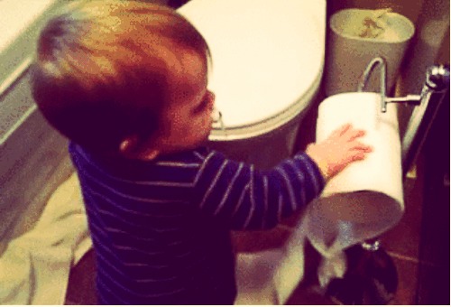 All kids love to unroll the paper. Stick with the end against the wall (underhand, not over) it will be much harder for them to unroll it then.
