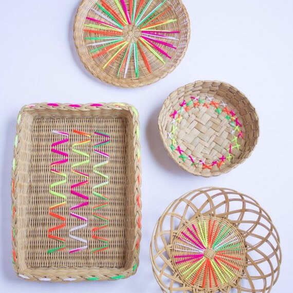 Yarn-Embroidered Baskets
You're bound to have some of these plain woven baskets lying around that could use this fun update! Thread a darning needle with colorful yarn and make a variety of designs to transform them into pretty decor pieces or catchalls. 