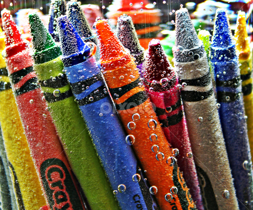 First take some hot tap water in a container and add your crayons to the container with water. Cover it and let it sit for 3-5 minutes. This is so it's easy to take off the wrapper later.