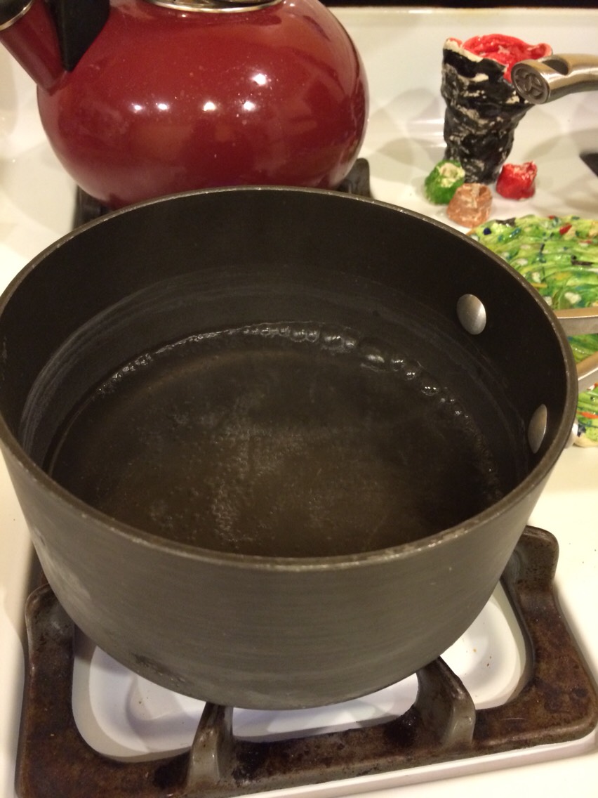 Put the pots on the stove and have the water boil. 