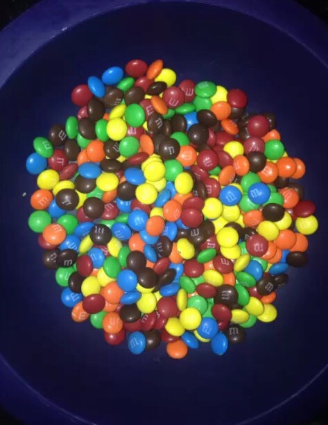 Add M&Ms on top of frosting 