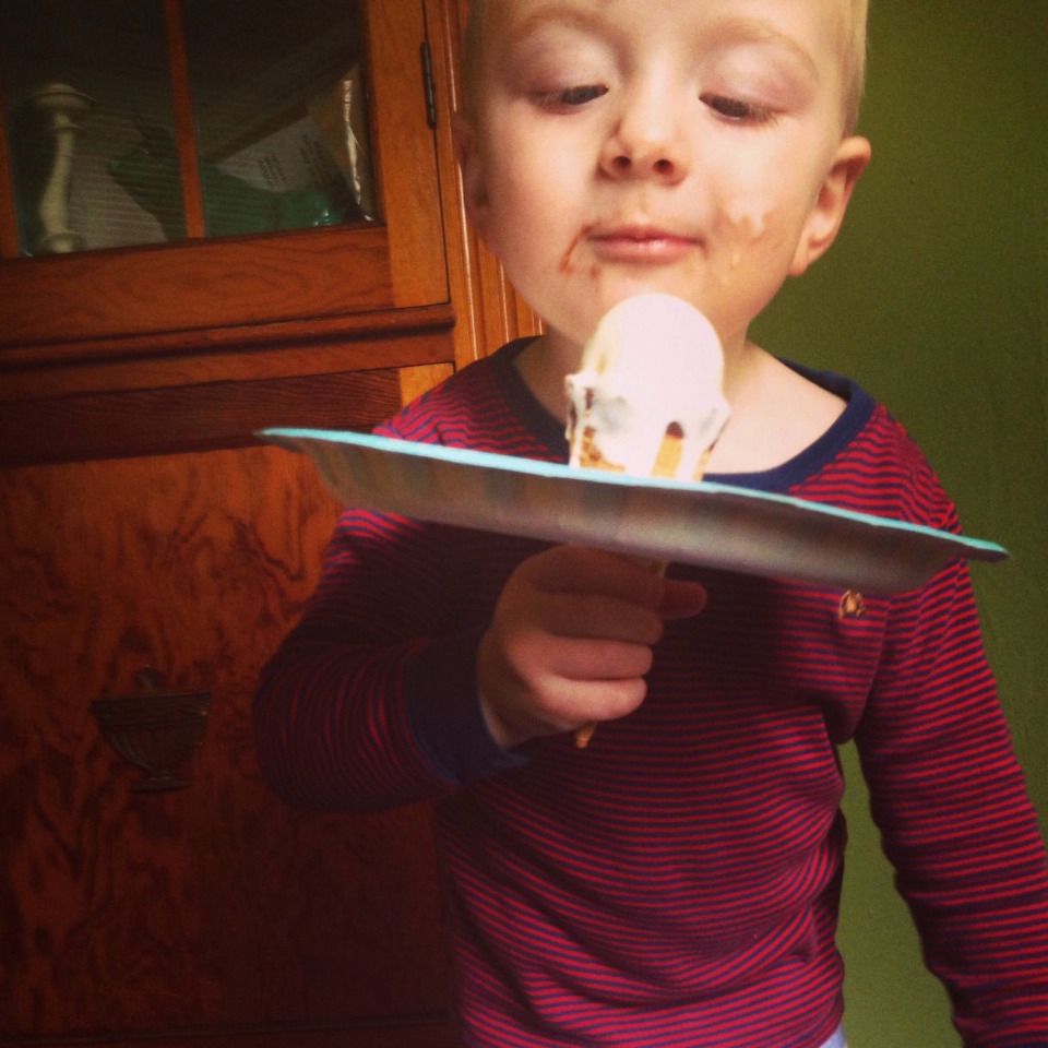 Cut a hole in a paper plate and place that delicious ice cream through it to prevent a sticky toddler :)