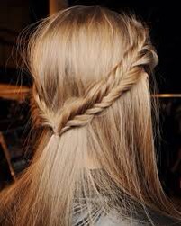 To do this hairstyle, just fishtail braid 2-3 inch sections of hair on both sides tie then together at the back of your head with a clear elastic!