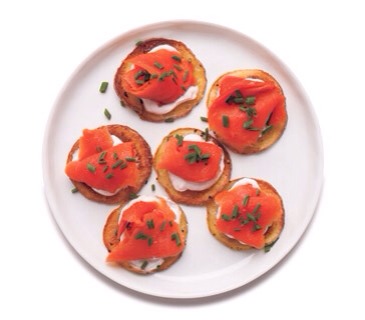 Smoked Salmon Potato Bites
Serve the yogurt and salmon on homemade baked potato chips—they’re simple to make in your oven.