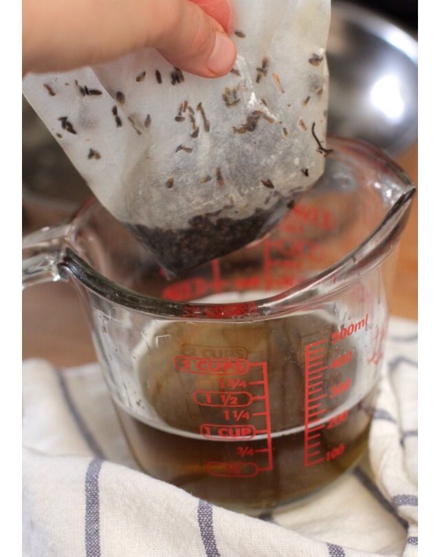 Step 2
After 30 minutes, prepare a small bowl with a coffee filter (or cheesecloth). Pour the mixture through the filter, filtering out the herbs. With the infused oil in the bowl below.