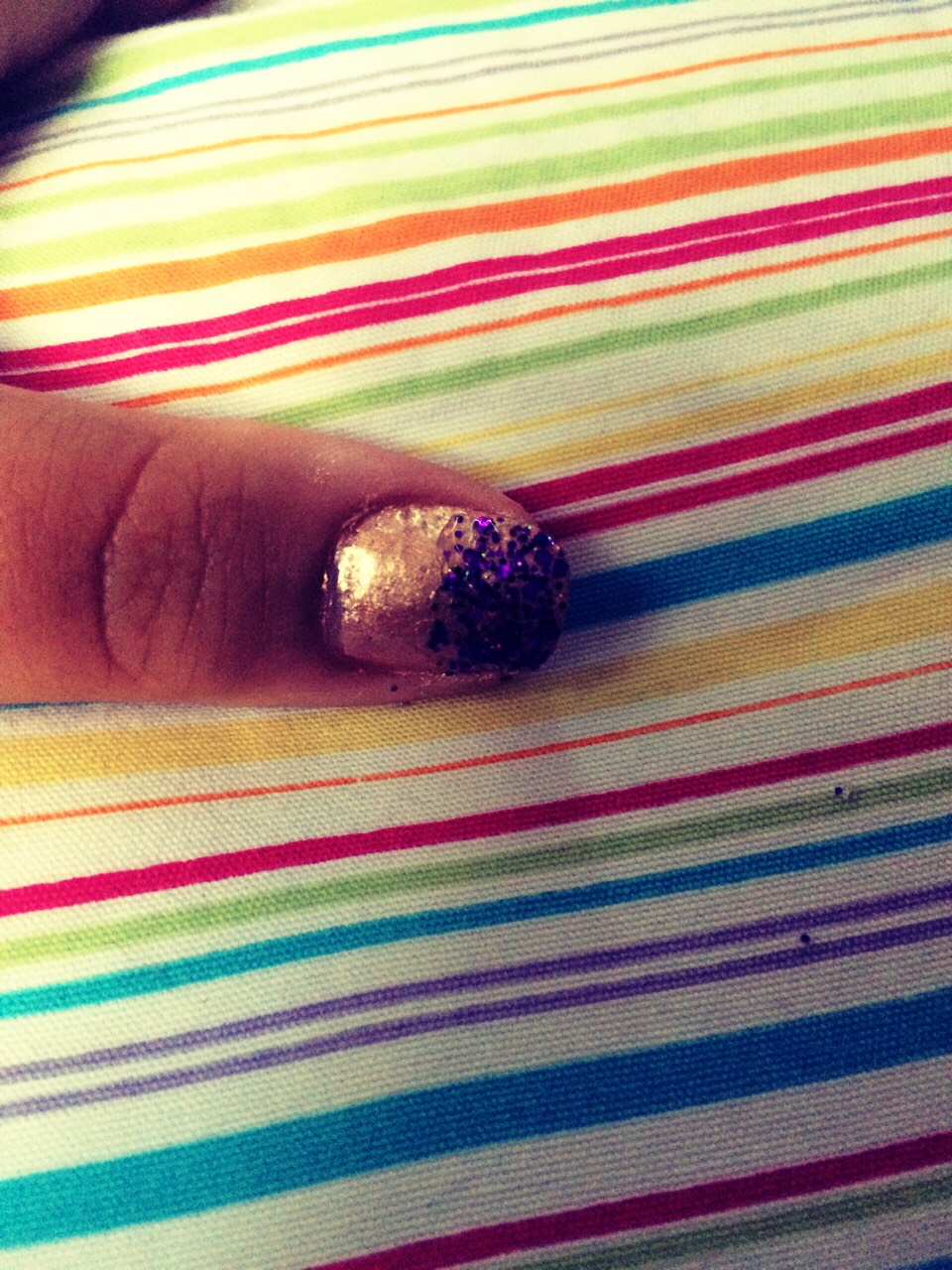 Apply glitter polish to half of your nail